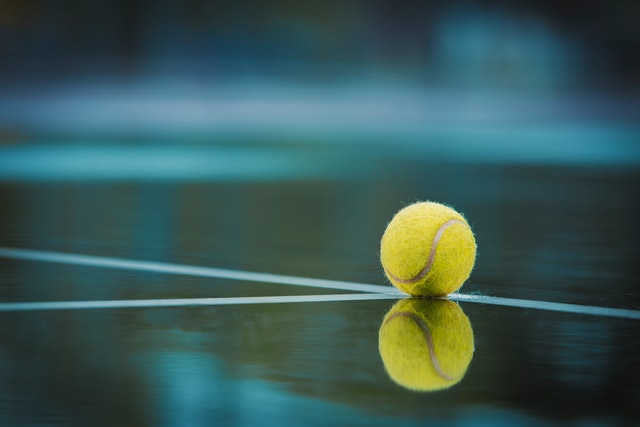 tennis ball on a wet court